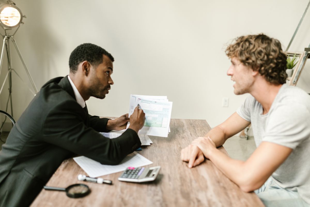 An advisor reviewing tax documents with a client